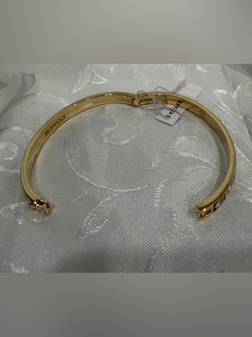 Coach Gold-Tone Bracelet with Black and White Enamel and Crystal - Picture 6 of 6